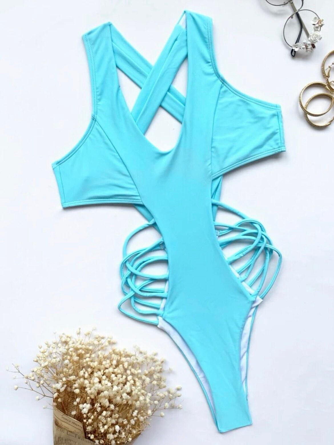 The Zona One Piece Swimsuit with a criss cross sides, high cut, high leg, cut out, sexy vibe in light blue