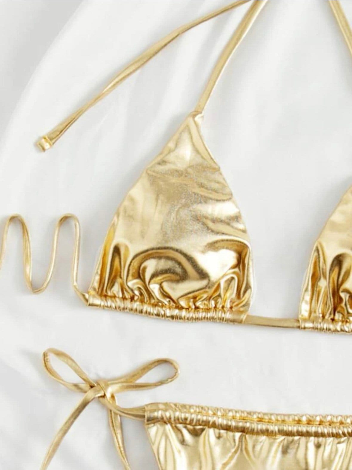 The Metallic gold swim bikini with tie sides and solid metallic gold print triangle halter top tie and bottoms swimsuit set