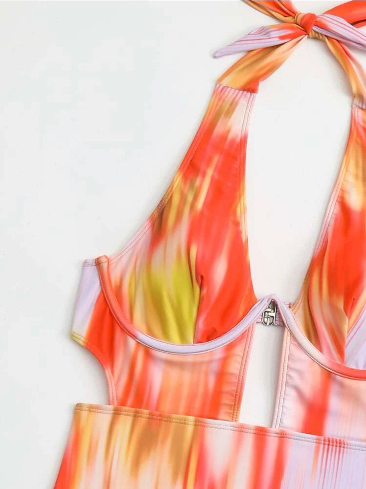 The Sexy Tie Dye One Piece Swimsuit with an underwire cutout halter tie dye pattern cut out, sexy vibe in orange or pink