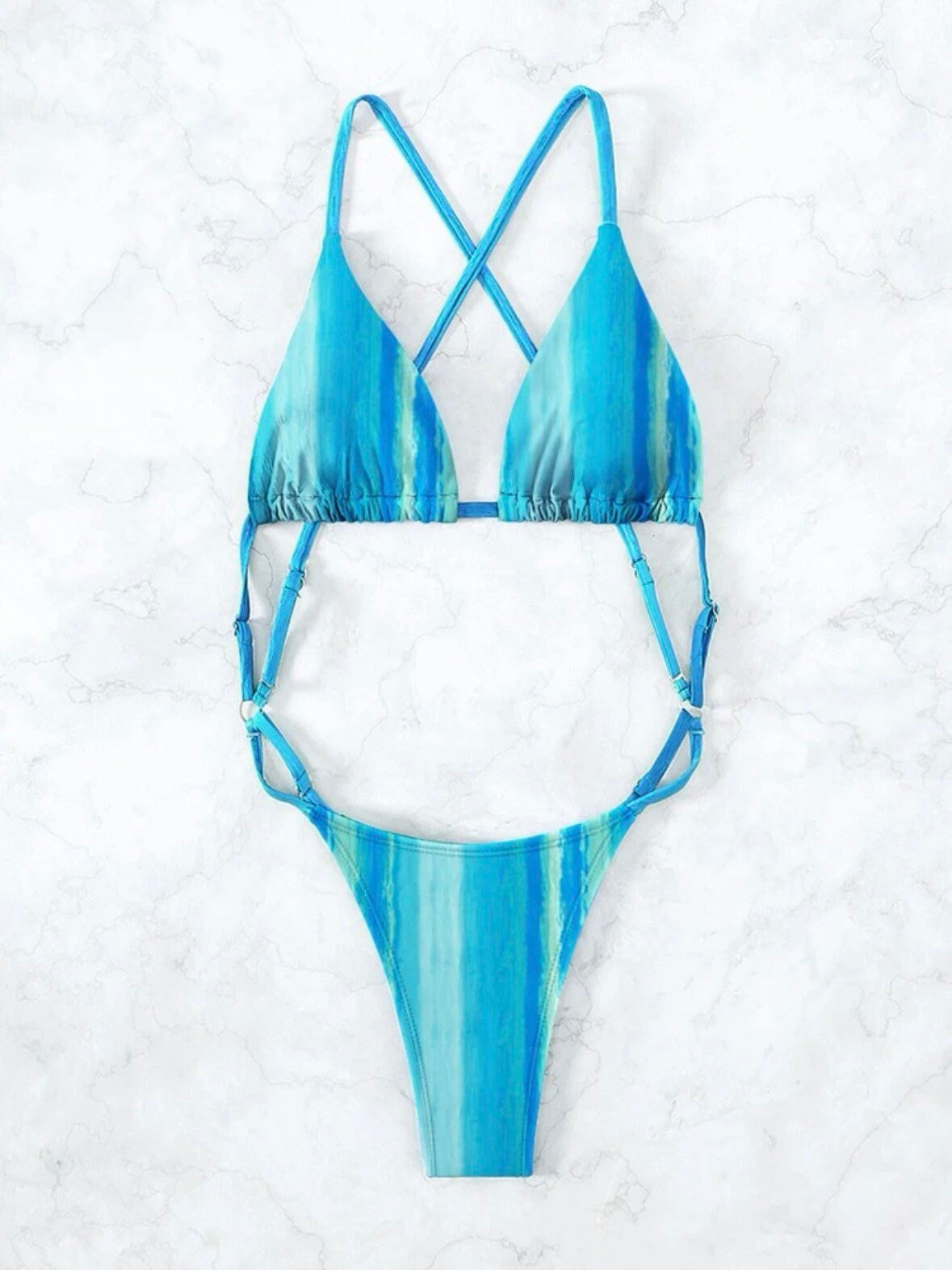 The Tie Dye Sexy One Piece Swimsuit with a backless, high cut, criss cross, micro sexy vibe in blue, pink, or red tones